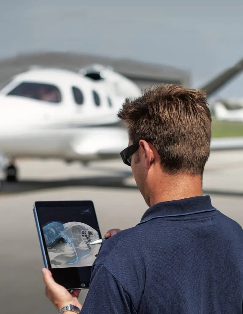 man preflighting vision jet with ipad